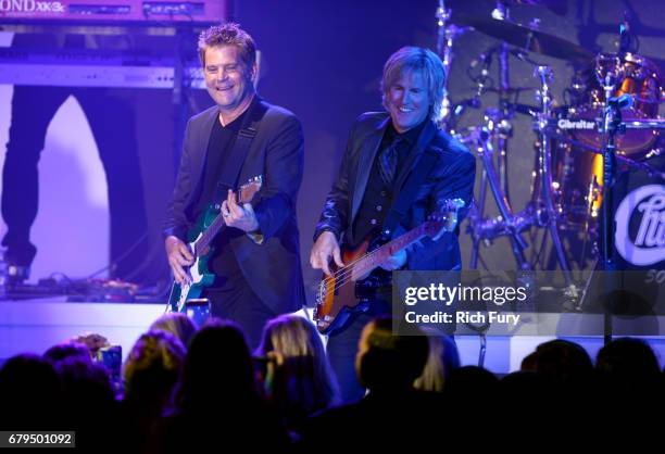 Musicians Keith Howland and Jeff Coffey of Chicago perform at the 24th Annual Race To Erase MS Gala at The Beverly Hilton Hotel on May 5, 2017 in...