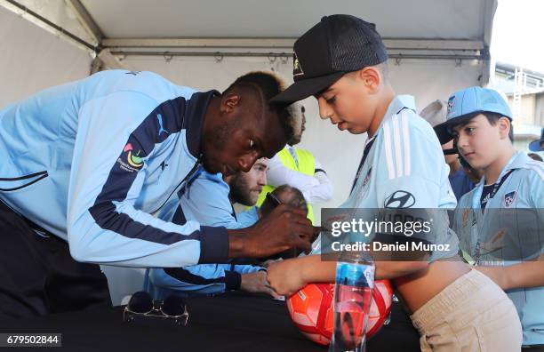 Bernie Ibini signs autographs during a Sydney FC A-League media opportunity at The Entertainment Quarter on May 6, 2017 in Sydney, Australia.