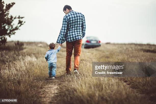 hold my hand boy - car back stock pictures, royalty-free photos & images