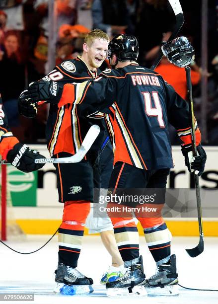 Corey Perry of the Anaheim Ducks celebrates his goal for a 4-3 win over the Edmonton Oilers with Cam Fowler during the second overtime in Game Five...