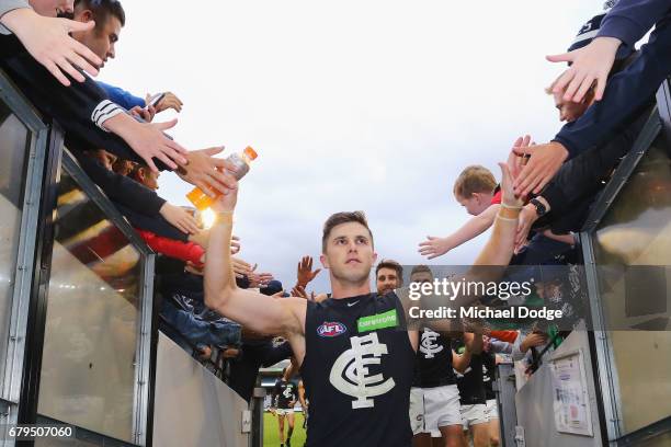 Marc Murphy of the Blues celebrates the win with fans during the round seven AFL match between the Collingwood Magpies and the Carlton Blues at...