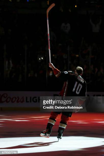 Corey Perry of the Anaheim Ducks waves to the crowd after being named the game's first star following the Ducks' 4-3 overtime win against the...