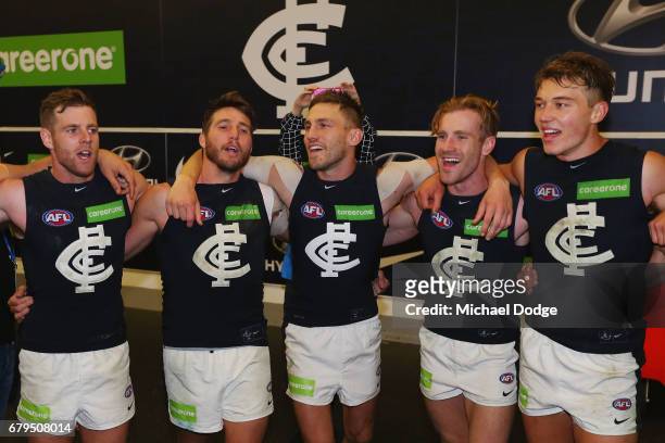 Sam Docherty Dale Thomas, Billy Smedts, Nick Graham and Patrick Cripps of the Blues sing the club song after winning during the round seven AFL match...