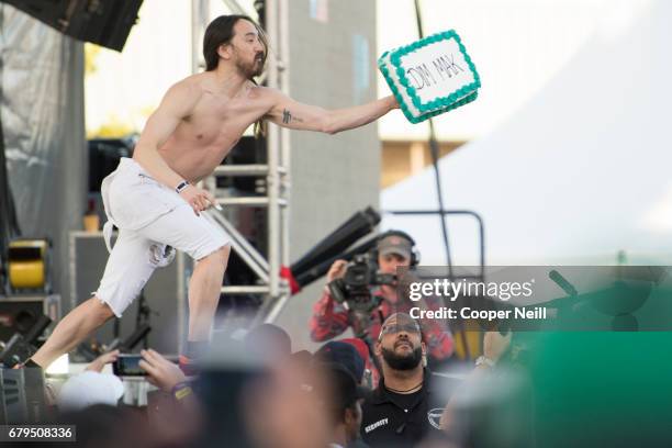 Steve Aoki throws a cake at fans during JMBLYA at Fair Park on May 5, 2017 in Dallas, Texas.