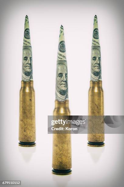 money bullet - terrorismus stock-fotos und bilder