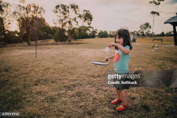 little girl playing badminton - birdie stock pictures, royalty-free photos & images