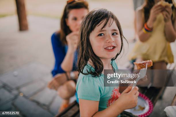 eating food at a family bbq - melbourne food stock pictures, royalty-free photos & images