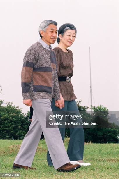 Emperor Akihito and Empress Michiko stroll outside the Hayama Imperial Villa on June 18, 1997 in Hayama, Kanagawa, Japan.