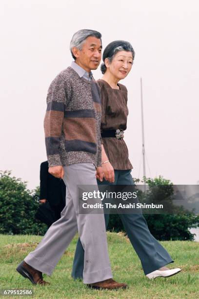 Emperor Akihito and Empress Michiko stroll outside the Hayama Imperial Villa on June 18, 1997 in Hayama, Kanagawa, Japan.