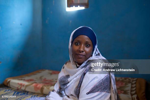 Woman who fled from violence in her home country of Somalia, sits in her new home on April 4, 2017 in the Nakavalie refugee camp in Uganda. Uganda...
