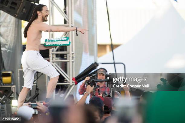 Steve Aoki throws a cake at fans during JMBLYA at Fair Park on May 5, 2017 in Dallas, Texas.