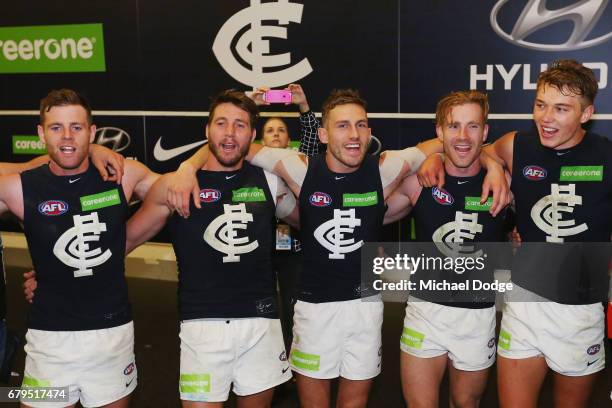 Sam Docherty Dale Thomas, Billy Smedts, Nick Graham and Patrick Cripps of the Blues sing the club song after winning during the round seven AFL match...