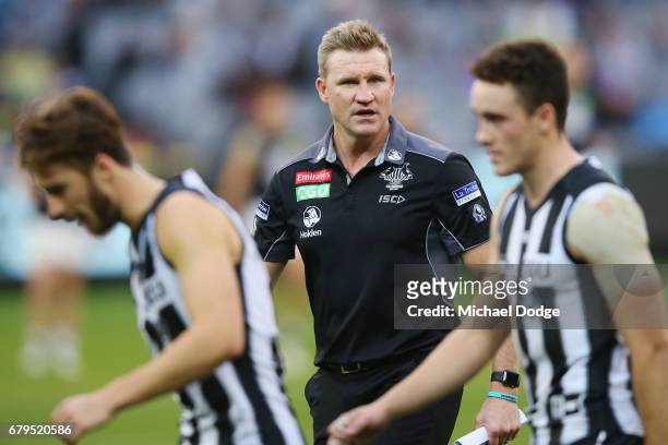 Magpies head coach Nathan Buckley speaks to Tim Broomhead of the Magpies during the round seven AFL match between the Collingwood Magpies and the...