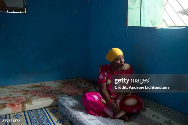 Woman who fled from violence in her home country of Somalia, sits in her new home on April 4, 2017 in the Nakavalie refugee camp in Uganda. Uganda...