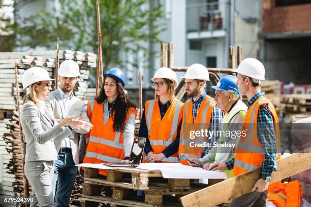 construction workers - construction meeting helmet stock pictures, royalty-free photos & images