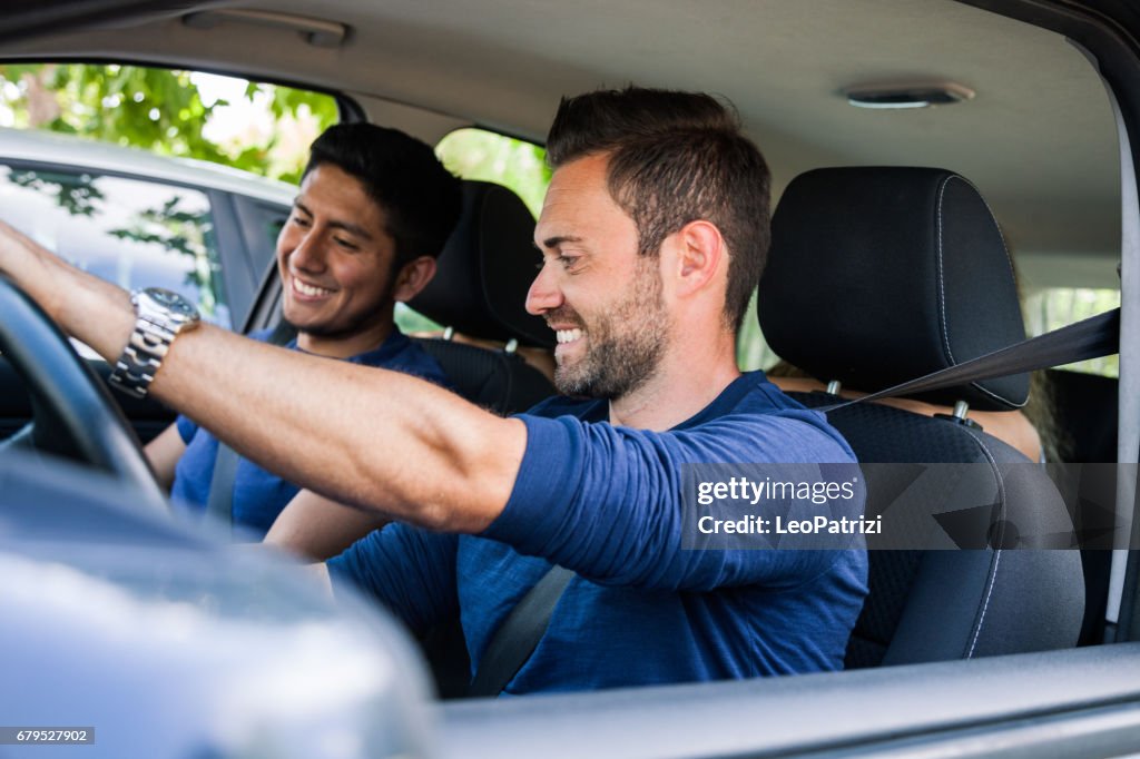 Friends sitting in the car ready to start vacations