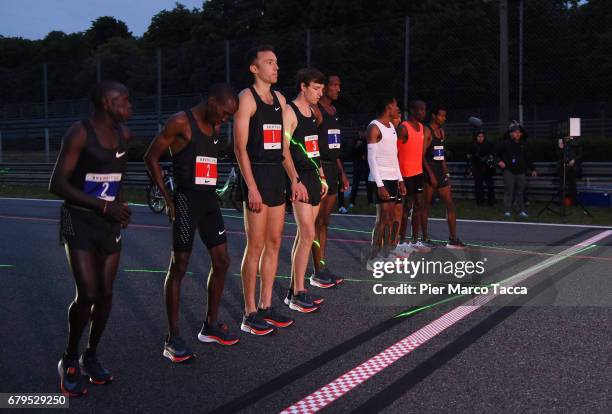 Lelisa Desisa, Zersenay Tadese and Eliud Kipchoge on the start line attend the Nike Breaking2: Sub-Two Marathon Attempt at Autodromo di Monza on May...