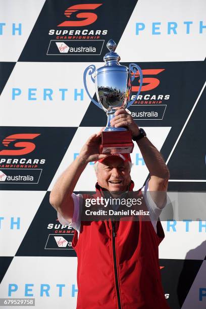 Roger Penske team owner of DJR Team Penske celebrates on the podium during race 7 for the Perth SuperSprint, which is part of the Supercars...