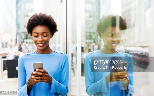 woman with mobile and reflection - women in see through shirts stock pictures, royalty-free photos & images