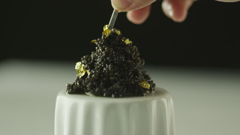 https://media.gettyimages.com/id/679536318/video/professional-cook-garnish-black-caviar-with-gold-in-luxury-restaurant.jpg?b=1&s=640x640&k=20&c=nX4AKnmPOhJFbutZMWJbRvFDp0dZdjrwFWL5HO0BIFQ=