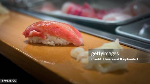 sushi nigiri on the counter bar - bar counter traditional stock-fotos und bilder