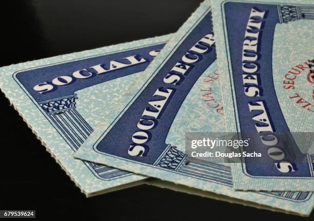 close up of us social security cards - 社会福祉 ストックフォトと画像