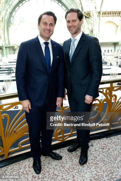 Prime Minister of Luxembourg Xavier Bettel and his husband Architect Gauthier Destenay attend the "Revelations" Fair at Balcon d'Honneur du Grand...