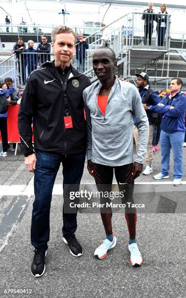 Nike President and CEO Mark Parker poses with Eliud Kipchoge on the finish area during the Nike Breaking2: Sub-Two Marathon Attempt at Autodromo di...