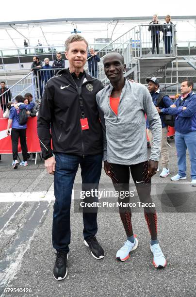 Nike President and CEO Mark Parker poses with Eliud Kipchoge on the finish area during the Nike Breaking2: Sub-Two Marathon Attempt at Autodromo di...