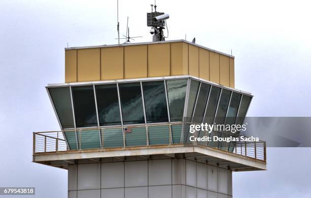 view of air traffic control tower against sky - lookout tower stock-fotos und bilder