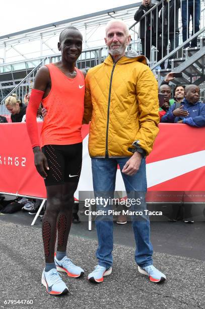 Eliud Kipchoge poses with Sandy Bodecker VP action Sport at Nike at the finish area during the Nike Breaking2: Sub-Two Marathon Attempt at Autodromo...