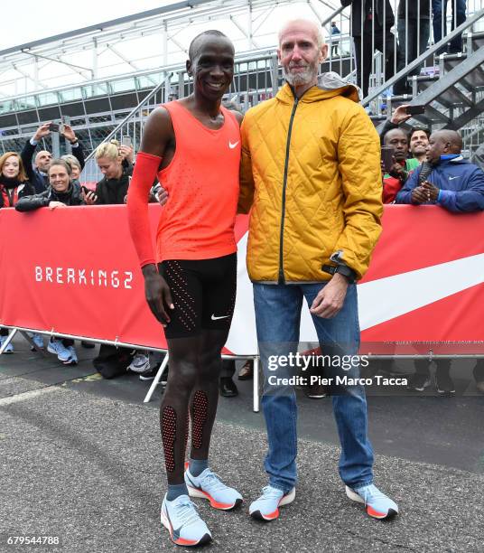 Eliud Kipchoge poses with Sandy Bodecker VP action Sport at Nike at the finish area during the Nike Breaking2: Sub-Two Marathon Attempt at Autodromo...