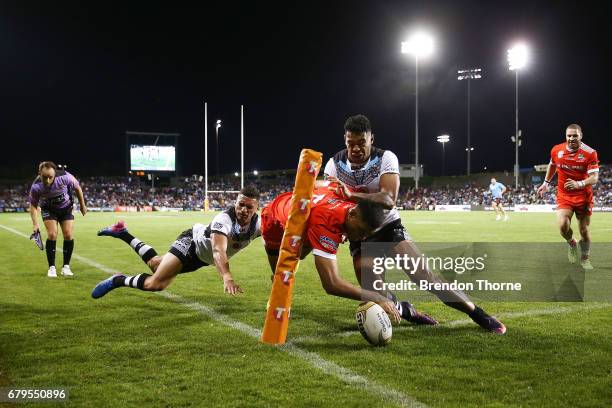 Daniel Tupou of Tonga dives to score a try during the 2017 Pacific Test Invitational match between Tonga and Fiji at Campbelltown Sports Stadium on...