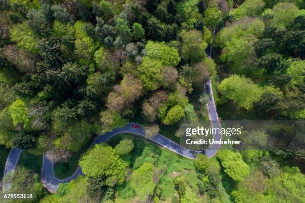 areal view of a curvy road - country road stock pictures, royalty-free photos & images