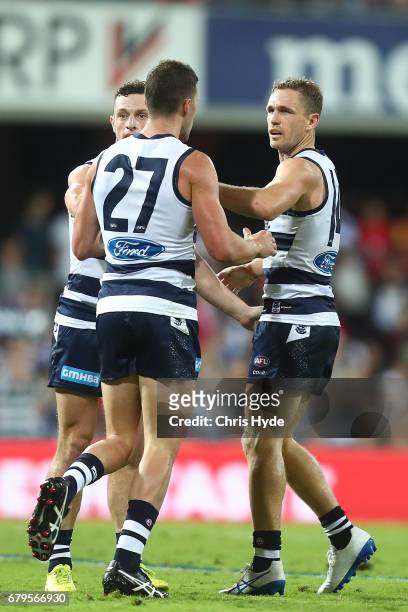 Joel Selwood of the Cats celebrates a goal during the round seven AFL match between the Gold Coast Suns and the Geelong Cats at Metricon Stadium on...