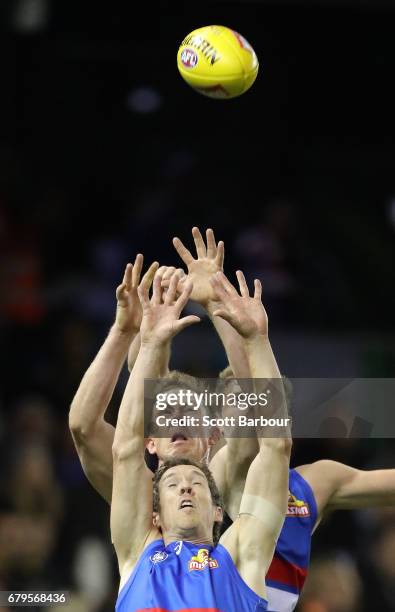 Robert Murphy of the Bulldogs and Jack Riewoldt of the Tigers compete for the ball during the round seven AFL match between the Western Bulldogs and...