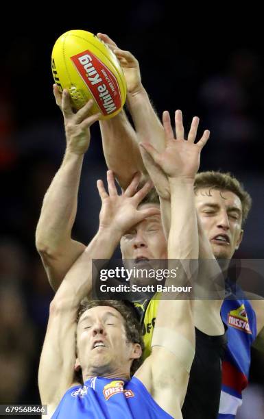 Robert Murphy of the Bulldogs and Jack Riewoldt of the Tigers compete for the ball during the round seven AFL match between the Western Bulldogs and...