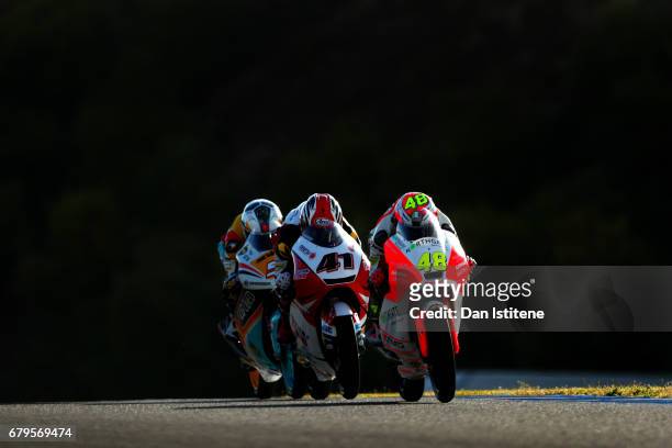 Lorenzo Dalla Porta of Italy and Aspar Mahindra Moto3 rides ahead of Nakarin Atiratphuvapat of Thailand and Honda Team Asia and Romano Fenati of...