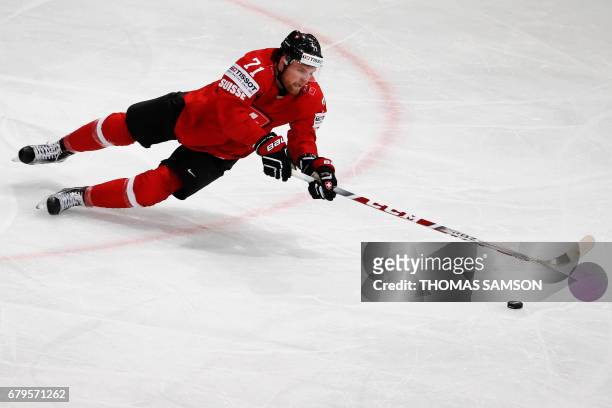 Switzerland's Tanner Richard controls the puck during the IIHF Men's World Championship group B ice hockey match between Switzerland and Slovenia on...