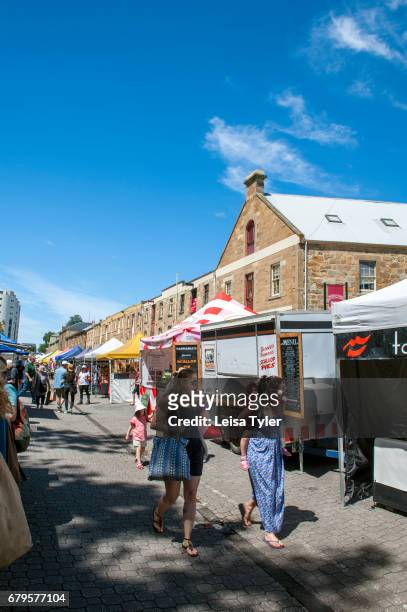 Visitors to the Saturday Salamanca Market at Salamanca Place in Hobart, Tasmania. The arts and crafts market is one of the island's biggest tourist...