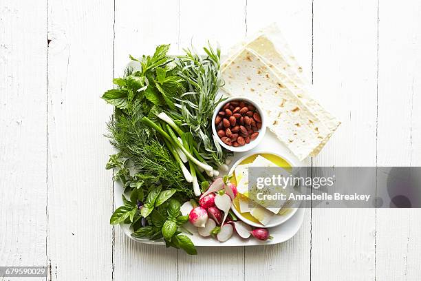 overhead of appetizer plate with cheese and herbs - annabelle(2014) ストックフォトと画像