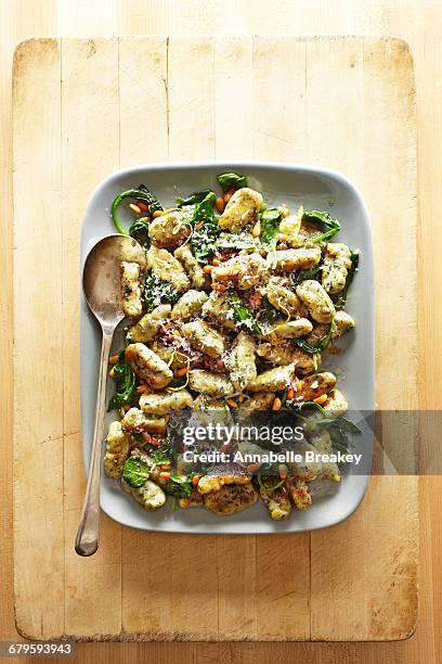 overhead of gnocci, pine nuts and spinach - annabelle(2014) ストックフォトと画像