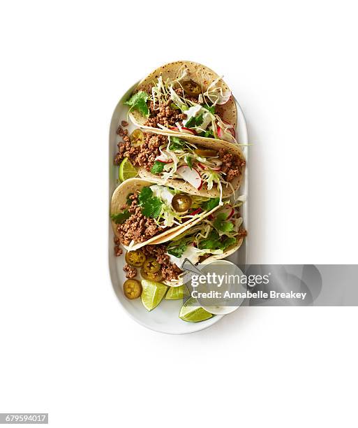 overhead of beef taco plate on white - mexican food plate stock pictures, royalty-free photos & images