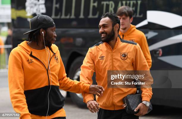 Dieumerci Mbokani of Hull City and Ahmed Elmohamady of Hull City arrive at the stadium prior to the Premier League match between Hull City and...