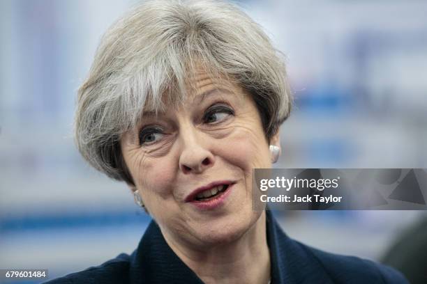 British Prime Minister Theresa May tours the UTC Aerospace Systems factory during a campaign visit on May 6, 2017 in Wolverhampton, England....