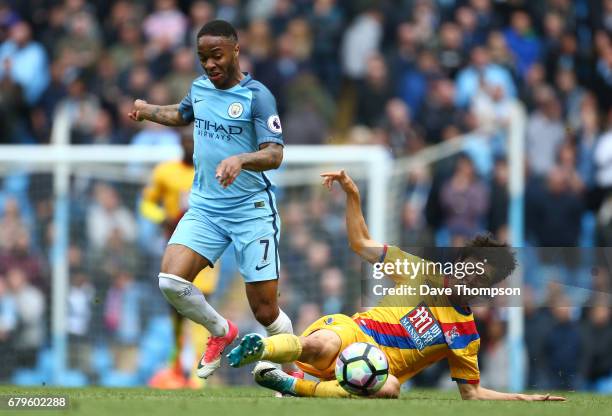 Raheem Sterling of Manchester City and Chung-yong Lee of Crystal Palace battle for possession during the Premier League match between Manchester City...