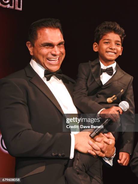 Nick Bassi and Sunny Pawar, winner of the Rising Star of the Year award, attend The Asian Awards at Hilton Park Lane on May 5, 2017 in London,...