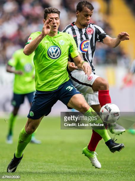 Mario Gomez of Wolfsburg and Timothy Chandler of Frankfurt fight for the ball during the Bundesliga match between Eintracht Frankfurt and VfL...