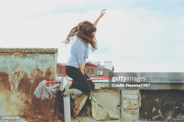 frau auf einem besen fliegen - witch flying on broom stock-fotos und bilder