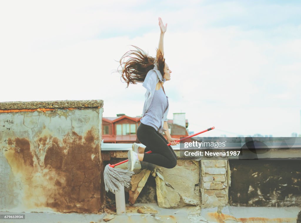 Woman flying on a broom